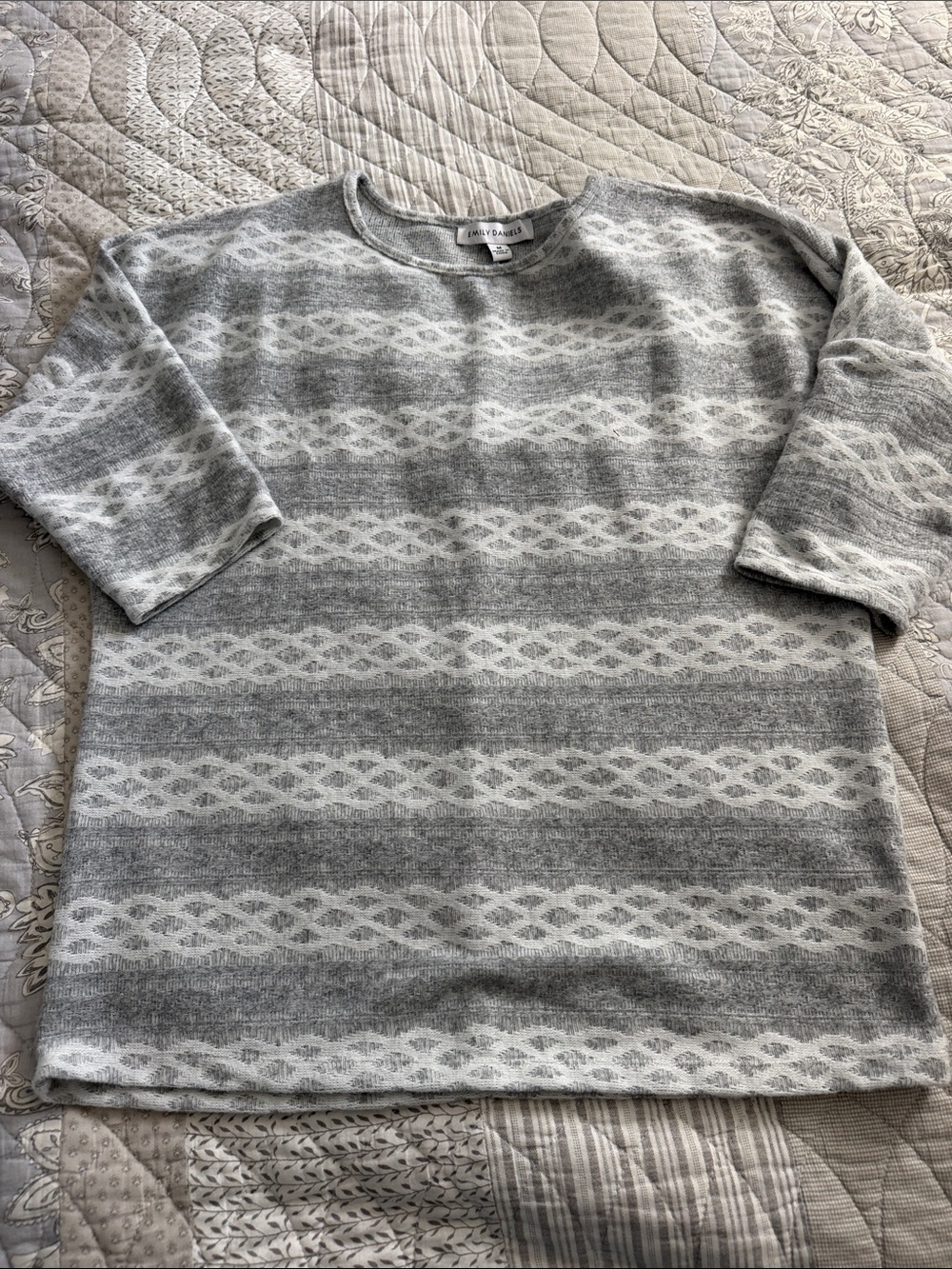 Emily Daniel’s Gray & White Patterned Crewneck Sweater